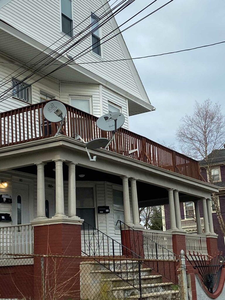 TV satellite dishes on a porch