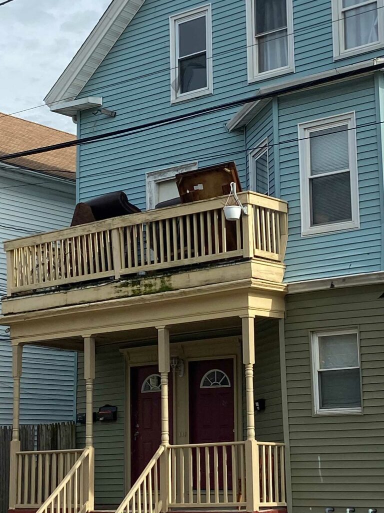 Items stored out on a porch