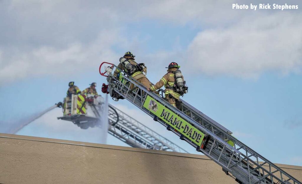 Two tower ladders at work with elevated streams