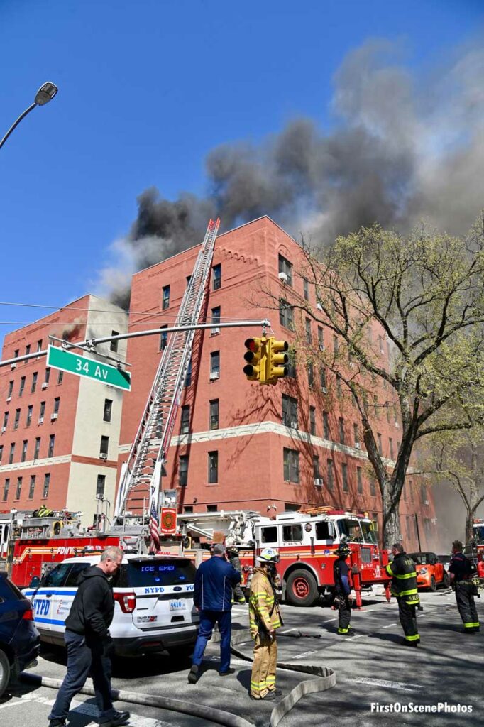 FDNY firefighters and apparatus at the scene of an eight-alarm fire in Queens