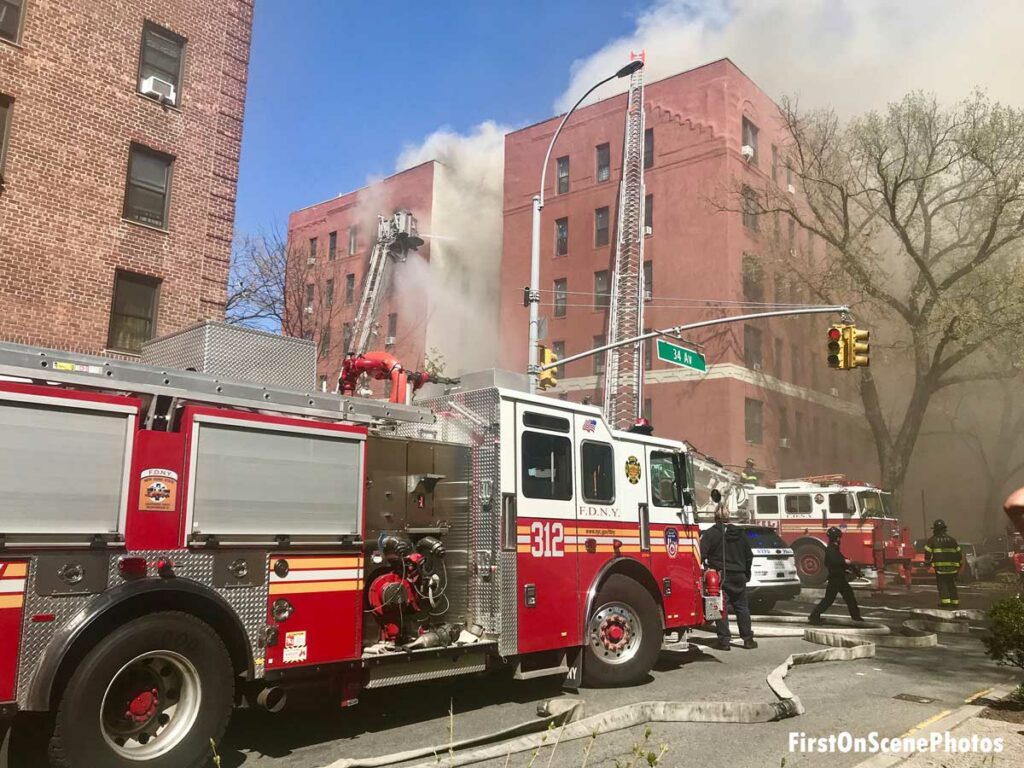 FDNY aerial ladder and tower ladder at eight-alarm fire in Queens