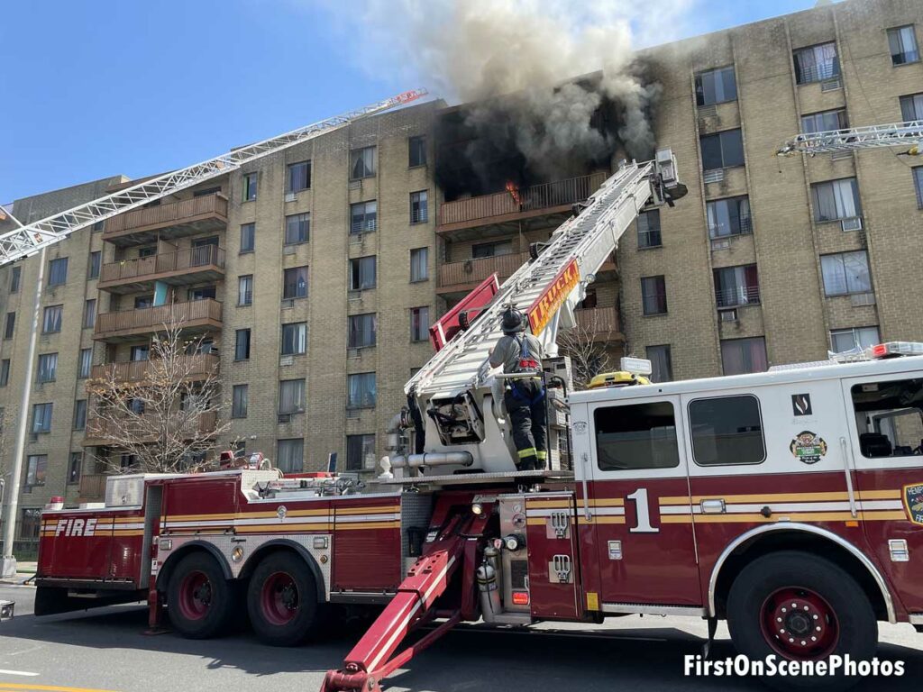 Smoke and flames on balcony with multiple aerials working