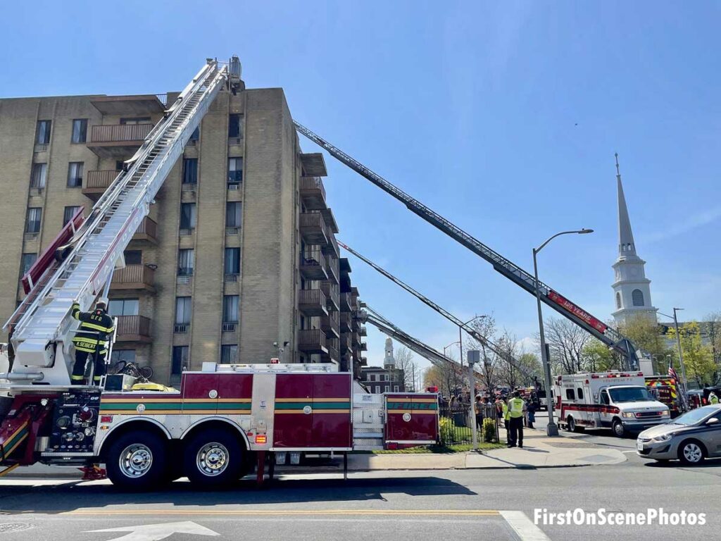 An array of aerial devices set up at apartment fire scene