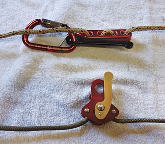 There are several different types of descent control devices on the market; they work using a positive grab between the rope and the device as well as a friction release handle.