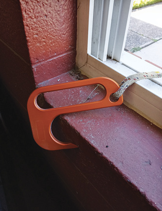 A loaded anchor hook. This will load into the wall; when used in gypsum board/drywall, the anchor will sink into the drywall and load on a wall stud.