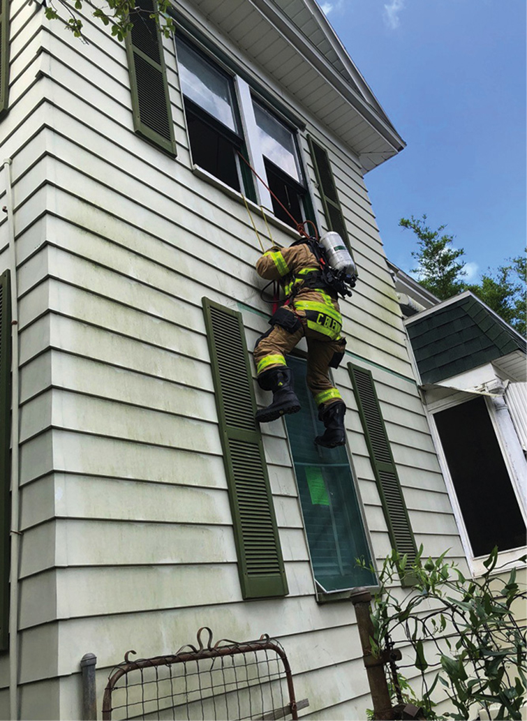 Crews were able to take advantage of a two-story home to practice safety and survival drills, including window bailouts. <em>(Photos by William Townsend unless otherwise noted.)