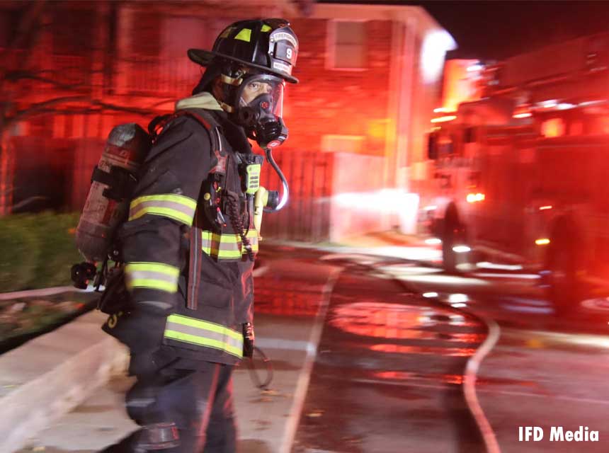 Indianapolis firefighter responding to the scene of a fire in March 2021