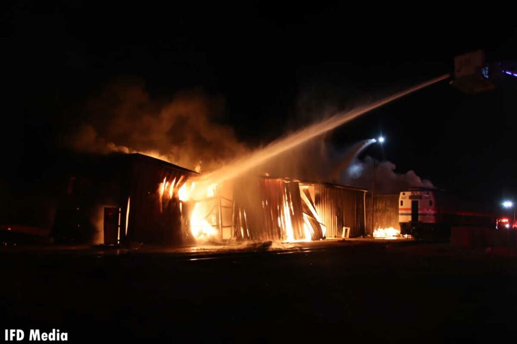 Indianapolis firefighters put water on burning storage building