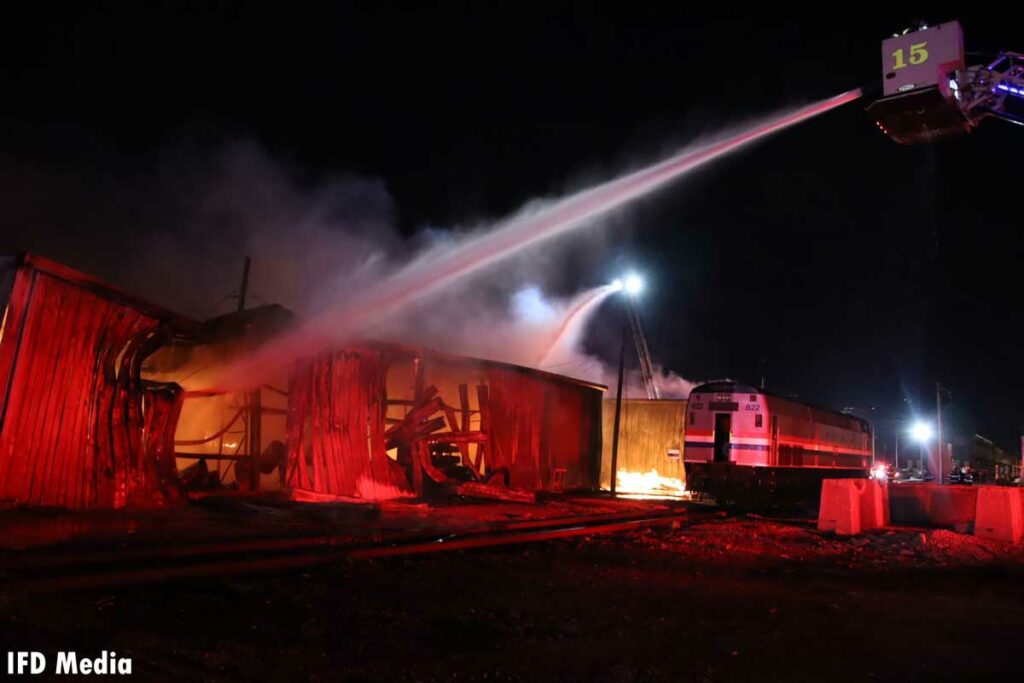 Indianapolis tower ladder flowing water onto burning building