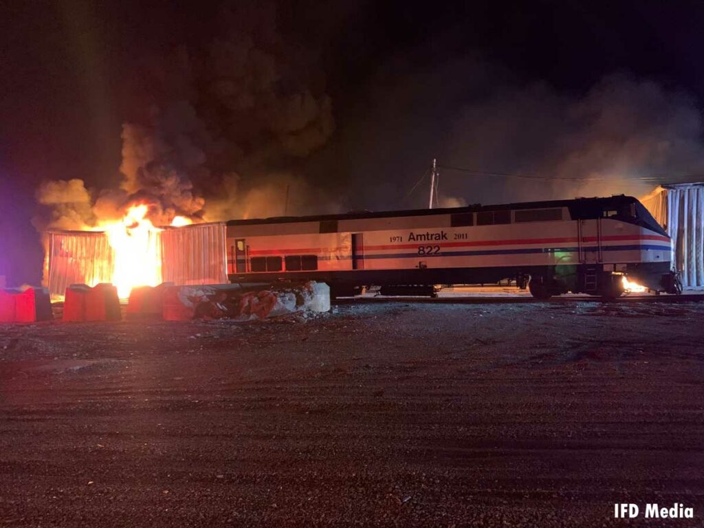 Train and fire burning in Amtrak storage buildings