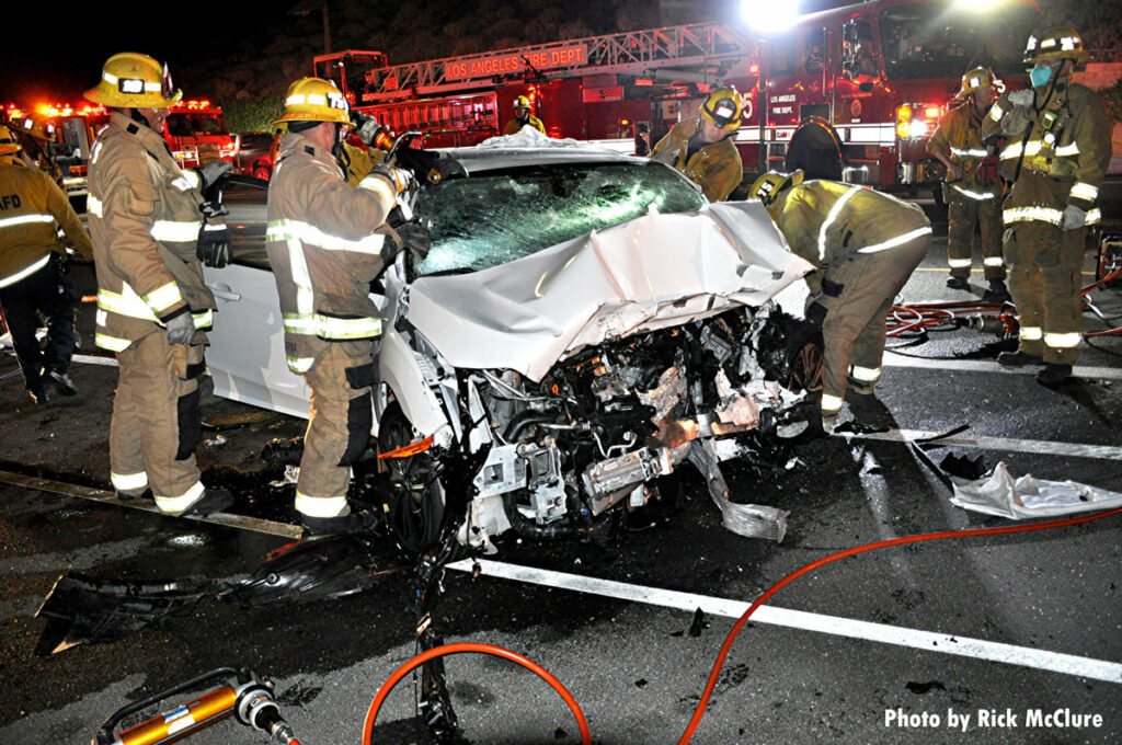 Firefighters attempt to access victim during motor vehicle accident in Los Angeles