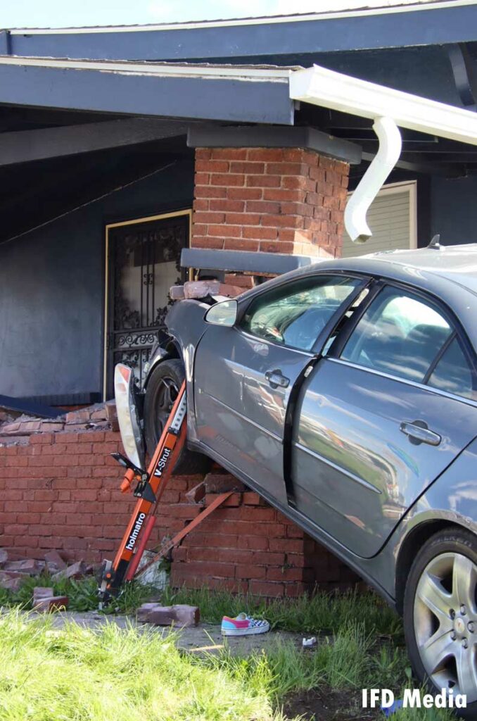 Indianapolis firefighters use hydraulic struts to keep the vehicle in place