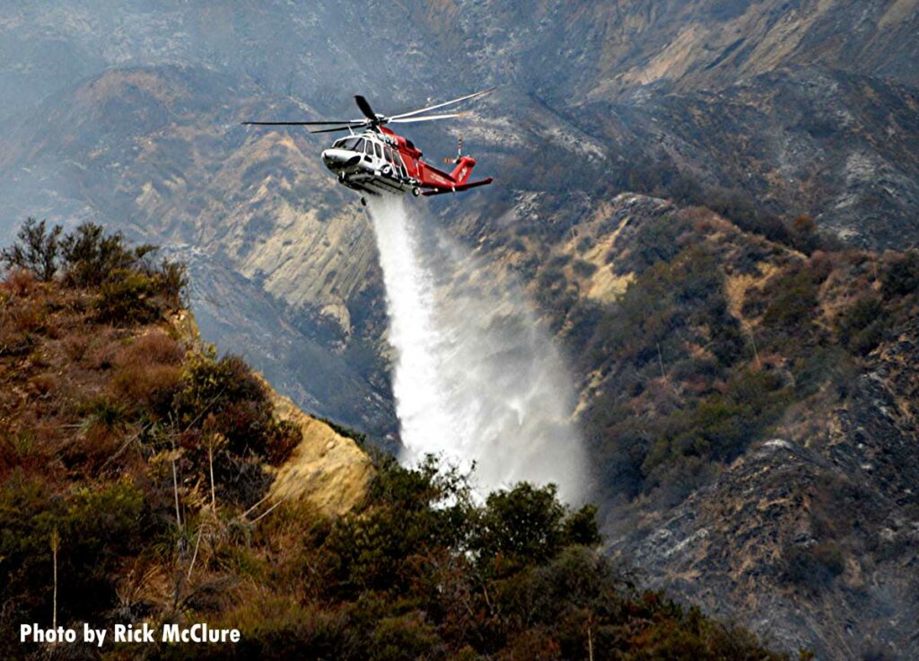 Helicopter makes retardant drop on Palisades File outside Los Angeles