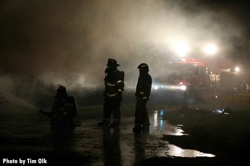 Firefighters in smoke at scene of fire in Danville, Iowa