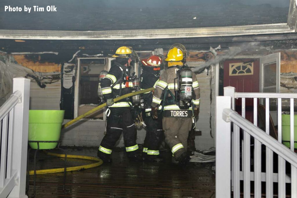 Firefighters put water under roofline at Iowa fire