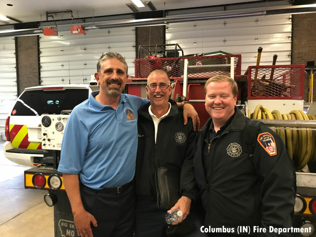 Columbus firefighters with Chief Anthony Kastros, at left