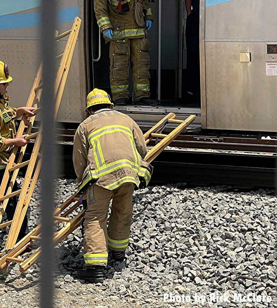 Firefighters employ ladders at rail incident in Los Angeles