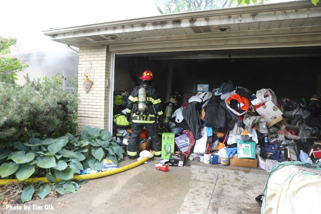 Firefighter enters a garage with hoarding conditions