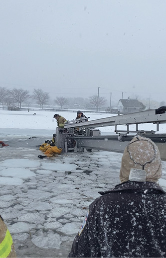 The other rescued occupant is in the bucket to the right.