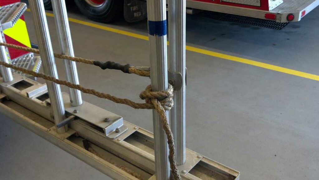 Halyard tied around bottom rung of ground ladder