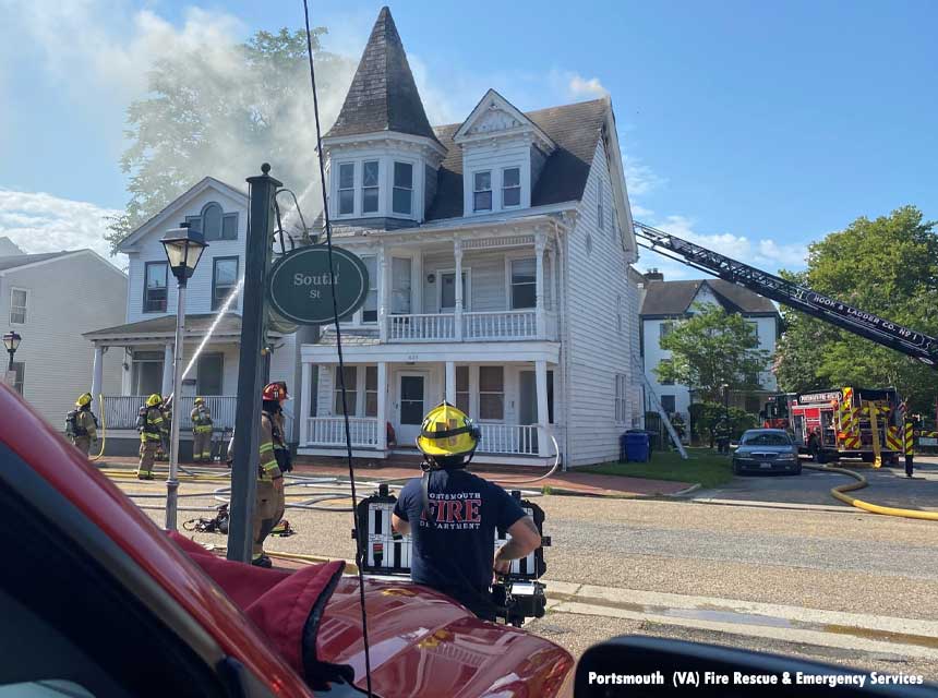 Portsmouth (VA) firefighters respond to a large fire affecting two residential structures in July 2021