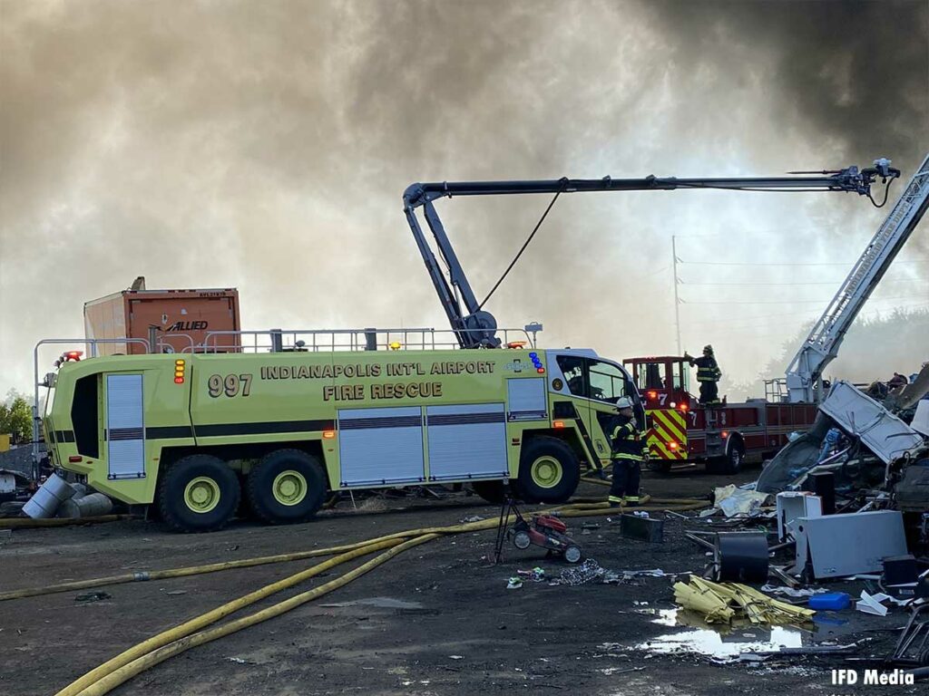 Indianapolis International Airport ARFF vehicle spraying water at fire scene