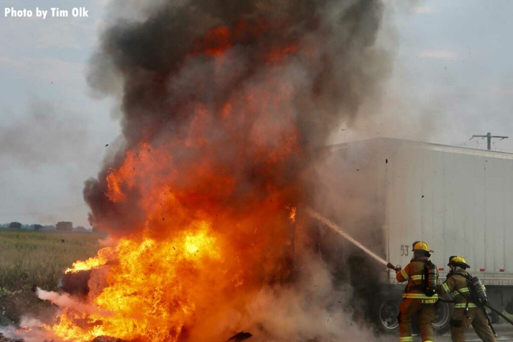 Flames roar from the cab during a semi fire in Boone County Fire Protection District 2