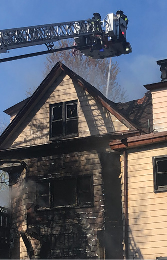 Autoexposure through the windows and running up the side of a building that has combustible siding can affect crews operating on the floors above. Have a hoseline in position to protect these firefighters.