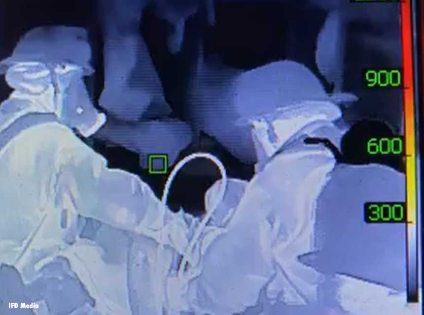 Thermal imaging view of two firefighters