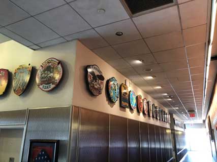 Company patches line the hallways at the Rock