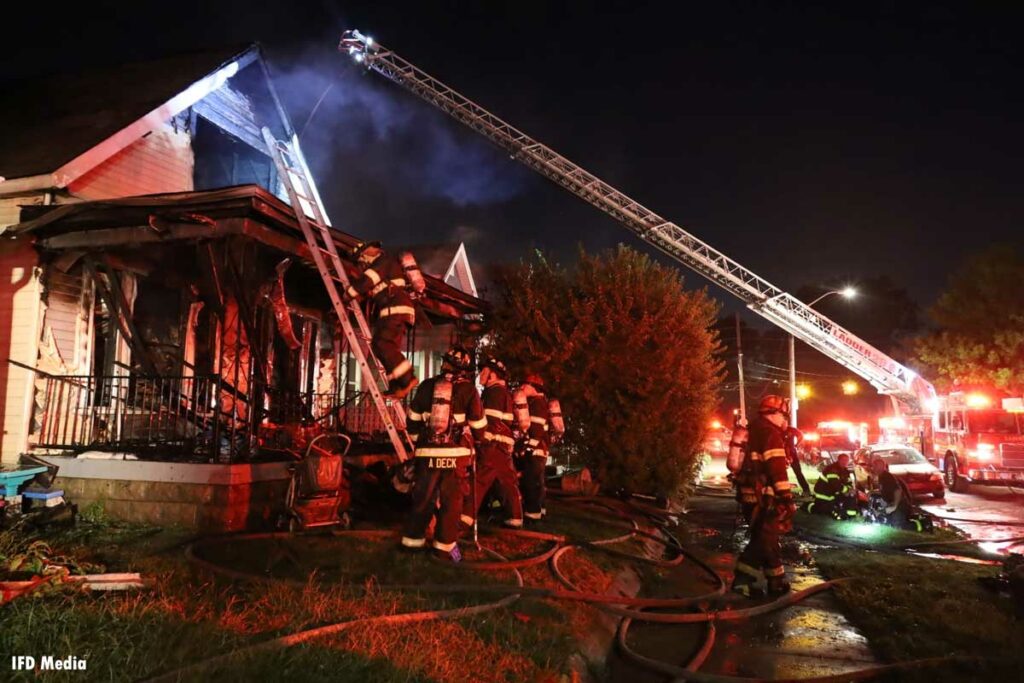 Multiple ladders thrown at the fire scene