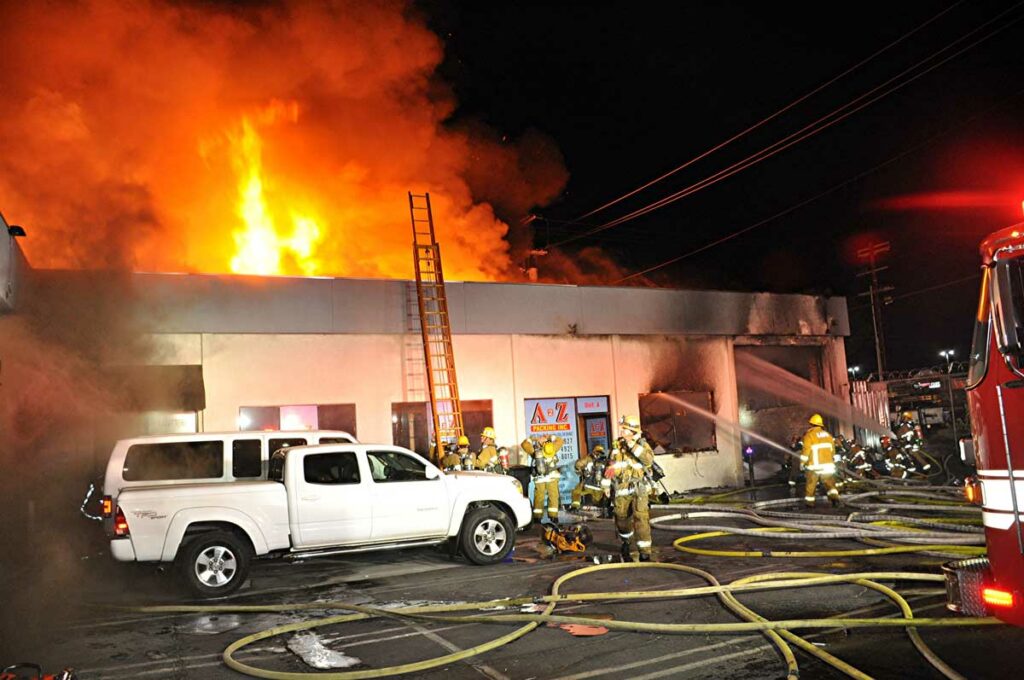 Multiple firefighters at the scene of a structure fire in Los Angeles