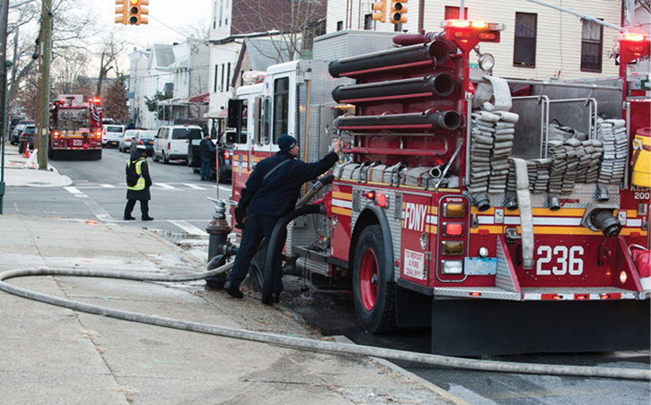 (2) In some settings, the backstretch (reverse lay) will be the best choice for water supply, or an engine company may have its own hydrant or be able to reach one with a short hand stretch. (Photo by Lloyd Mitchell.) 