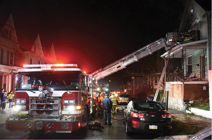 (8, 9) Requiring only one engine to commit to the area of the fire building early on minimizes congestion and allows access to position aerial devices advantageously. (Photos by Jason Coleman-Cobb.)