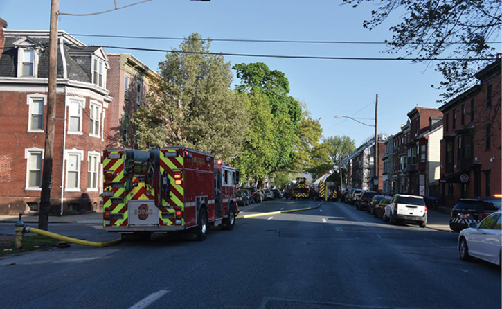 (8, 9) Requiring only one engine to commit to the area of the fire building early on minimizes congestion and allows access to position aerial devices advantageously. (Photos by Jason Coleman-Cobb.)