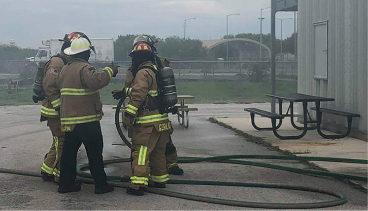 Firefighters use a training prop