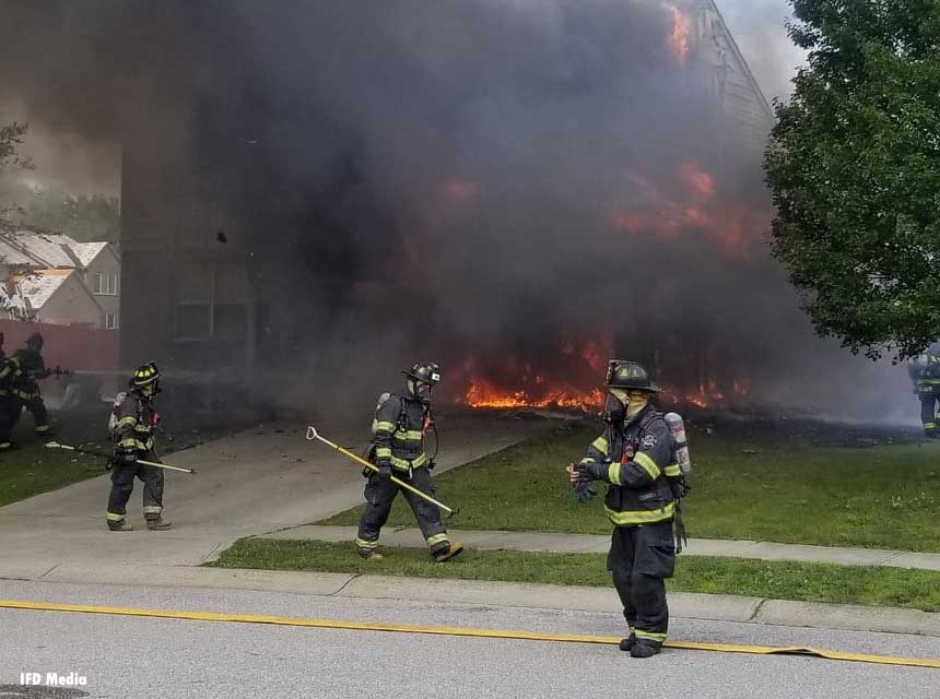 Indianapolis Fire Department firefighters battle garage fire