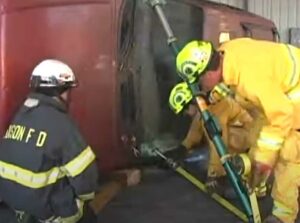 Firefighter stabilize a vehicle on its side