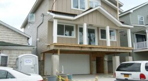 Podium wood-frame private dwellings are raised with the use of reinforced concrete from four to ten feet into the air.