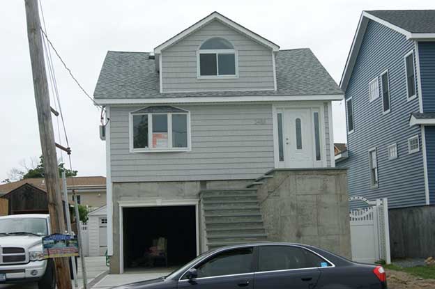 An open car port, where the podium is built as numerous columns, and an open space exists for cars to park beneath