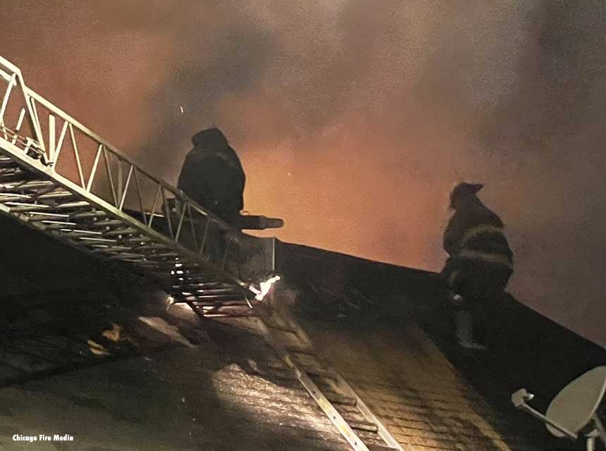 Chicago firefighters operate on the roof at a still and box alarm on September 4, 2021