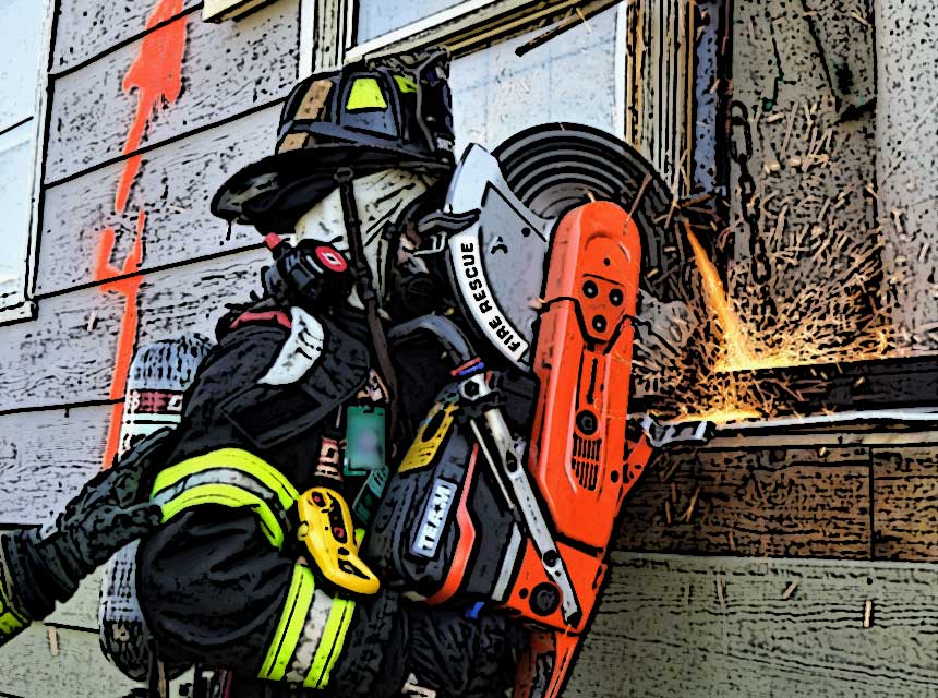 Firefighter in full PPE with a saw