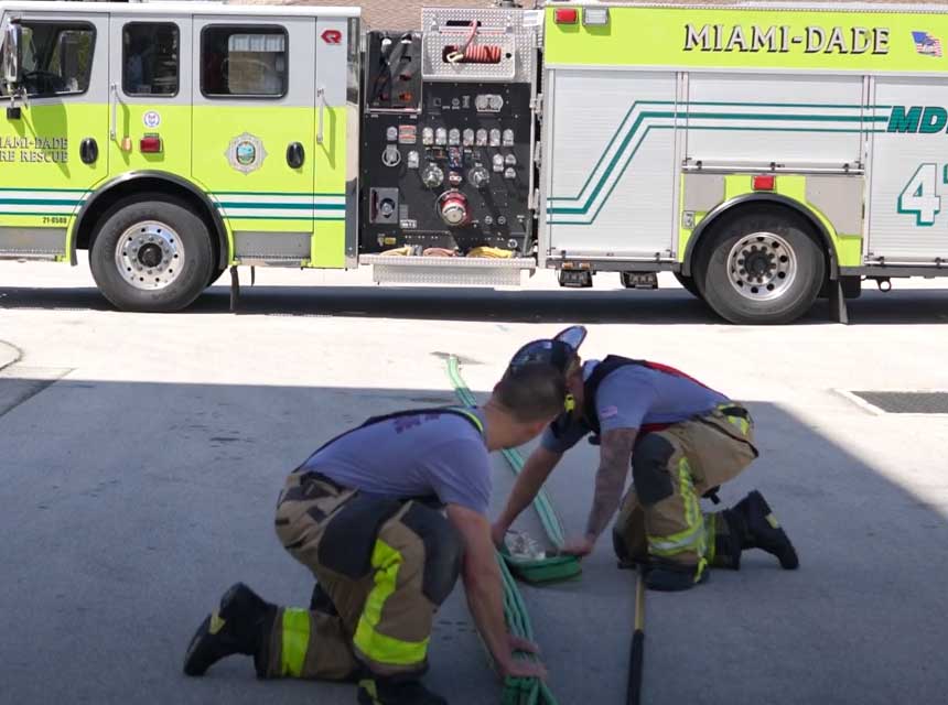 MDFR firefighters put together a hose bundle