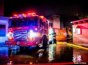 Boulder fire truck and firefighter at fire scene