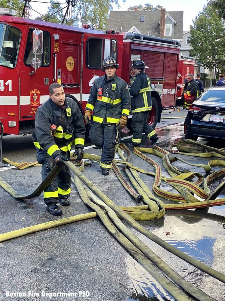 Boston firefighters with hoselines