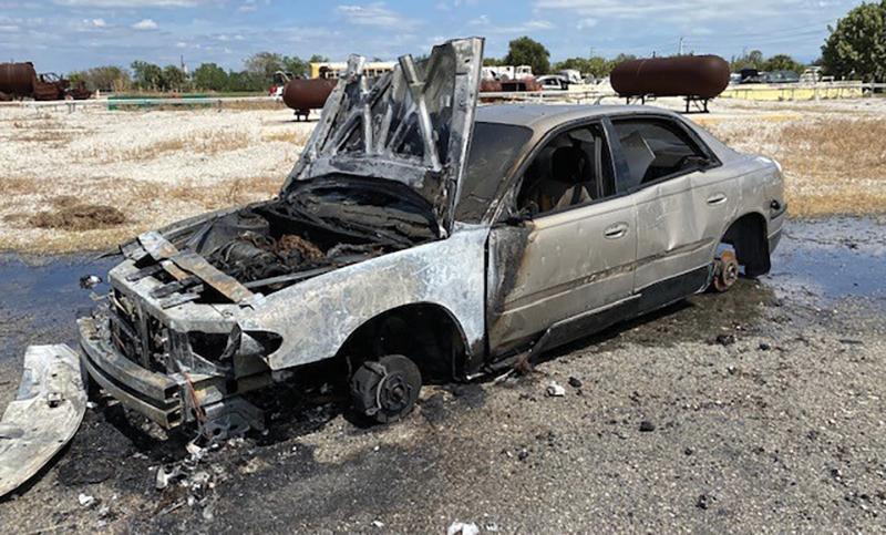 A fully involved engine compartment training exercise in which the fire was started in the engine compartment. In photo 4, note the burn pattern on the driver’s side door. Firefighters pushed back the hood during extinguishment.