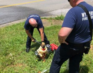 Firefighters maintain fire hydrants