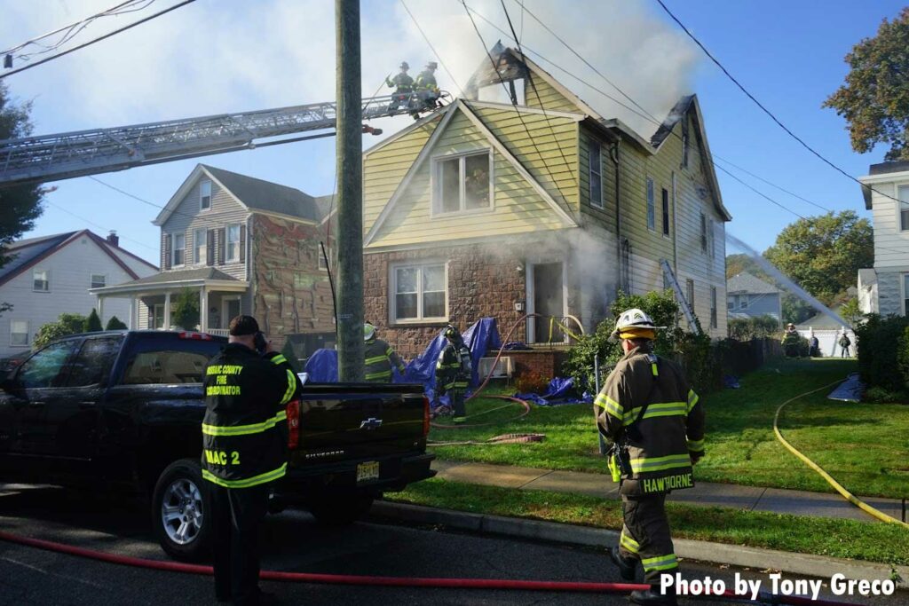 Firefighters operate at a house fire in Hawthorne, New Jersey