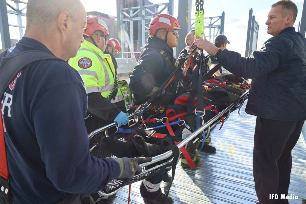 Indy firefighters load patient in stokes