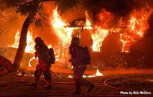 LAFD firefighters at the scene of massive fire engulfing garage